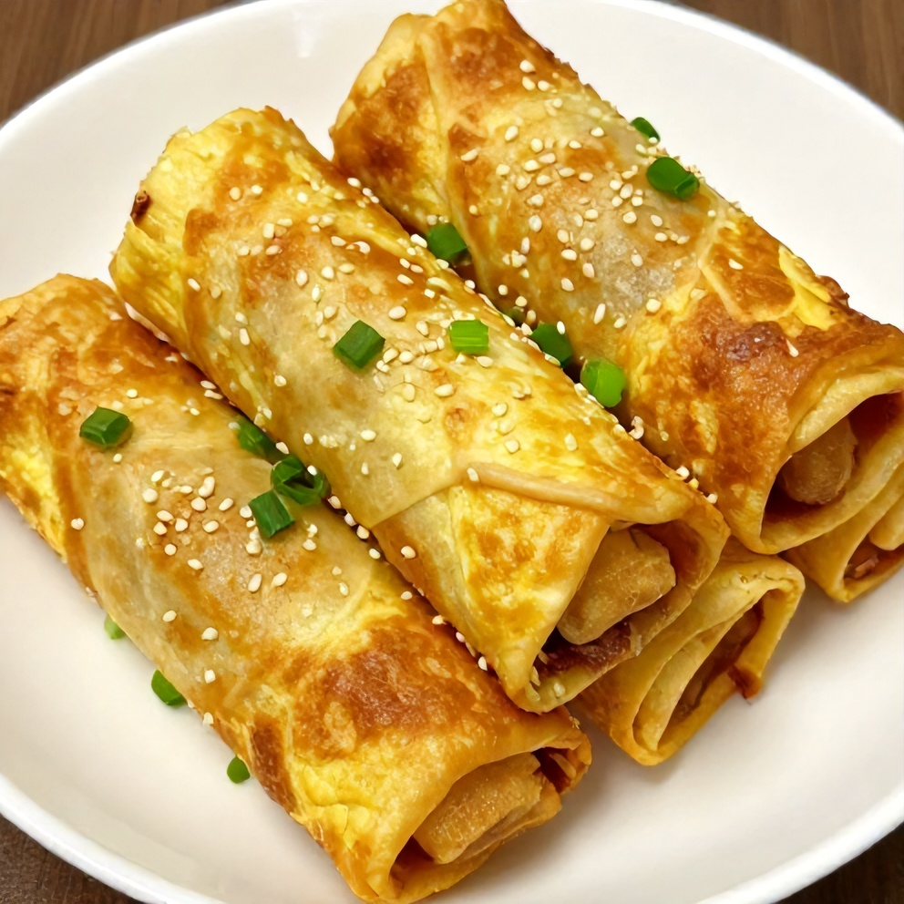 Keto Egg Roll in a Bowl plated with sesame seeds and green onions
