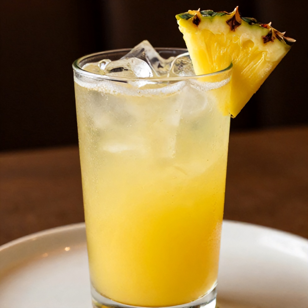 Pineapple Margarita Mocktail served in a glass with a salted rim and pineapple wedge garnish